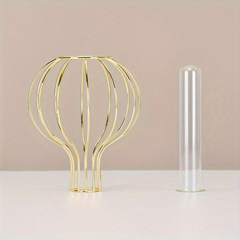 Soliflore en fer forme bulle présentation cadre et tube séparés sur une table.