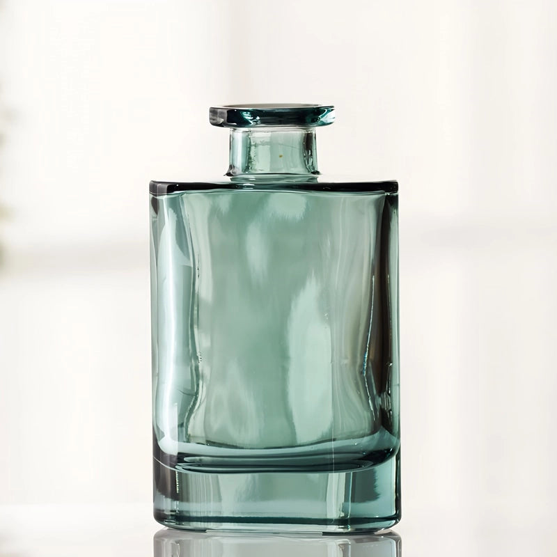 Soliflore Forme Petit Flacon Transparent Bleu en verre présentation sans fleurs