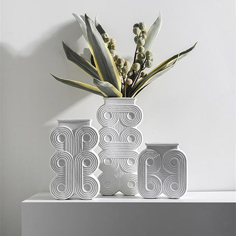 Vase colonne art déco motif rond présentation tous les modèles avec plantes et fleurs.