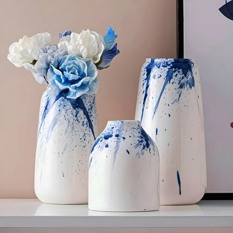 Vase Artistique Blanc et Encre Bleue en Céramique présentation des modèles M avec fleurs, et S et L sans fleurs.
