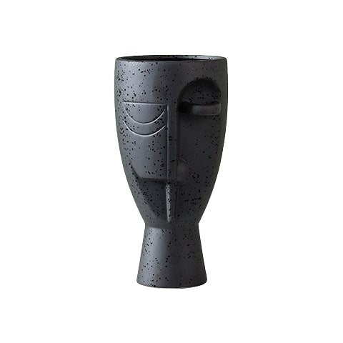 Vase en forme de visage style nordique modèle Noir Moucheté sur fond blanc.
