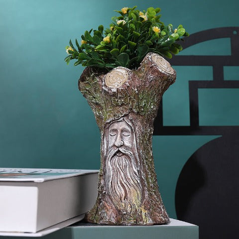 Vase créatif Arbre de la sagesse expressif en Résine présentation avec bouquet de fleurs.