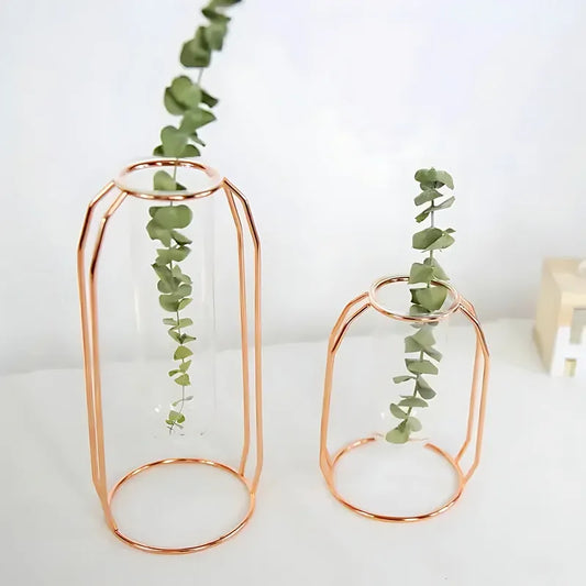 Soliflore Tube Suspendu Cadre Géométrique Rose Gold, présentation des modèles A et B avec plantes vertes sur une table blanche.