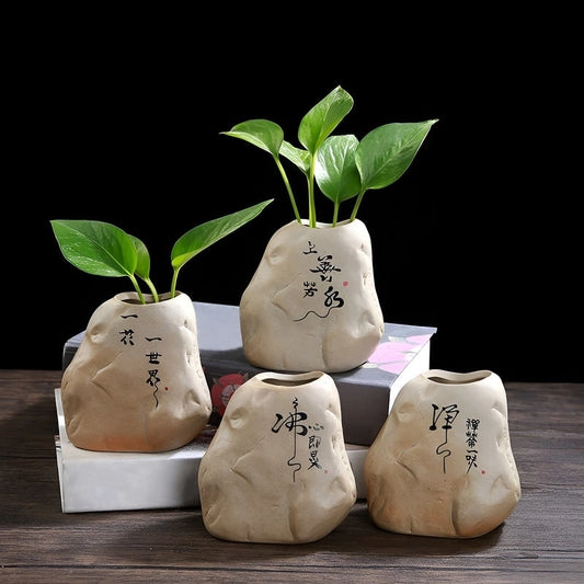 Vase Soliflore Mini-Rocher Zen présentation de tous les modèles avec plantes vertes sur une table en bois.