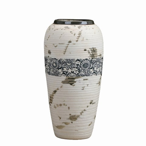 Vase tacheté décoration florale noire en céramique du modèle L sur fond blanc.