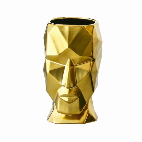 Vase visage design doré en céramique.